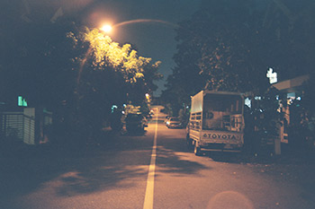 A photograph of a street at night